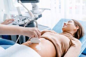 A pregnant woman gets a sonogram while hoping her spouse won’t need to pursue a $41 million verdict in a wrongful death misdiagnosis case.