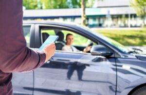 A rideshare driver gets ready to pick up a rider in New York. If you get hurt in a rideshare accident in New York, you could seek payment for your injuries from the liable party.